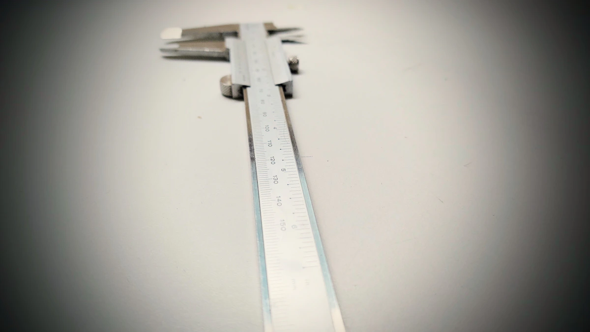 Ruler resting on a work surface beside a spreadsheet-estimating guide.